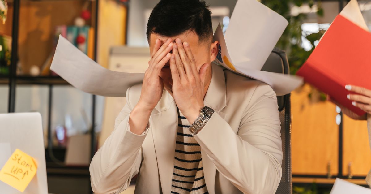 stressed businessman office desk